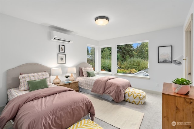 carpeted bedroom with a wall unit AC