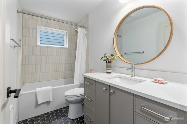 full bathroom with vanity, toilet, shower / tub combo, and tile patterned flooring