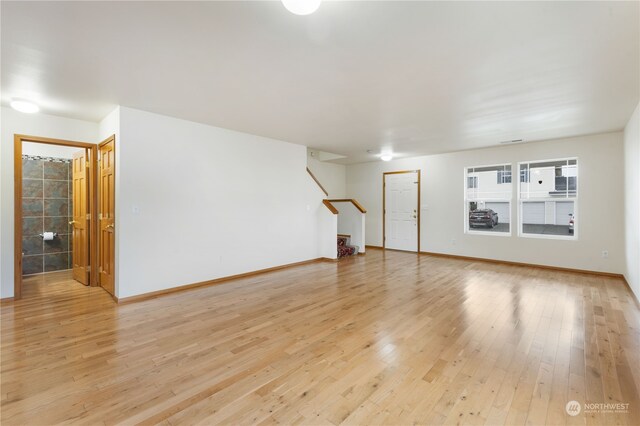 spare room featuring light hardwood / wood-style flooring