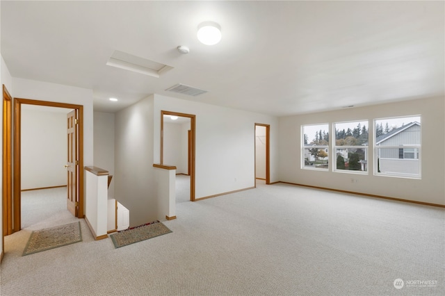 spare room with light colored carpet