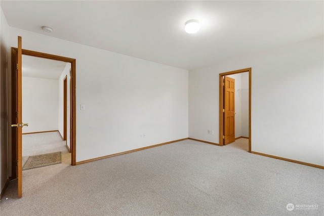 empty room featuring light colored carpet