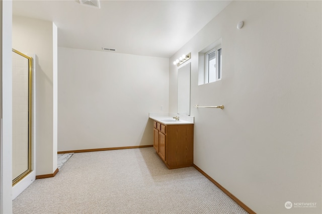 bathroom featuring vanity and walk in shower