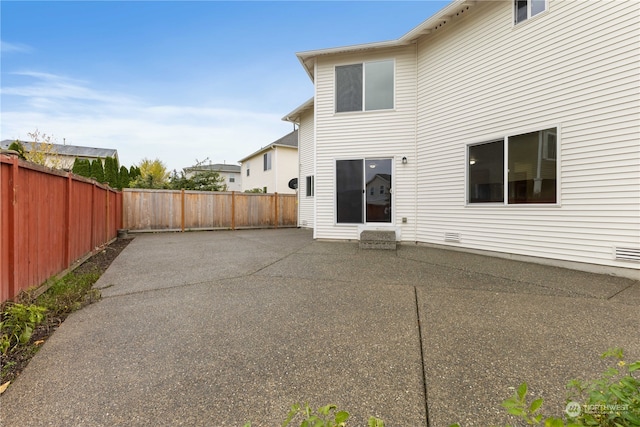 back of property featuring a patio