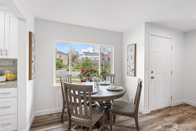 dining area featuring hardwood / wood-style flooring