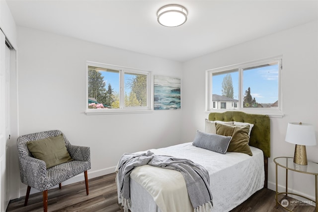 bedroom featuring dark hardwood / wood-style flooring