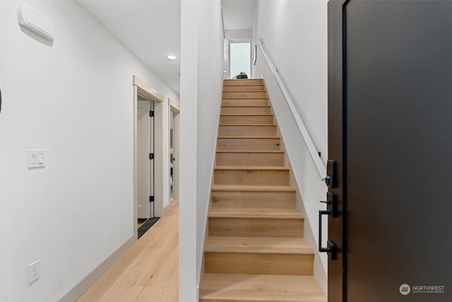 stairway with wood-type flooring