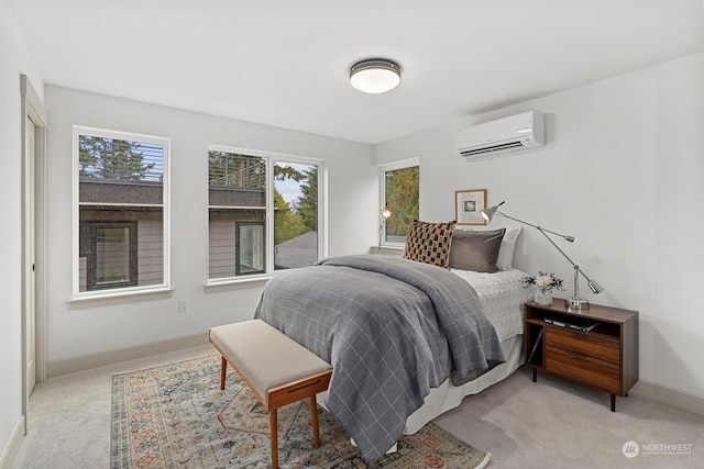 bedroom with light carpet and a wall unit AC