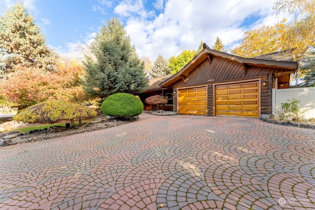 view of side of property featuring a garage