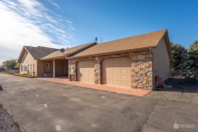 ranch-style home featuring a garage