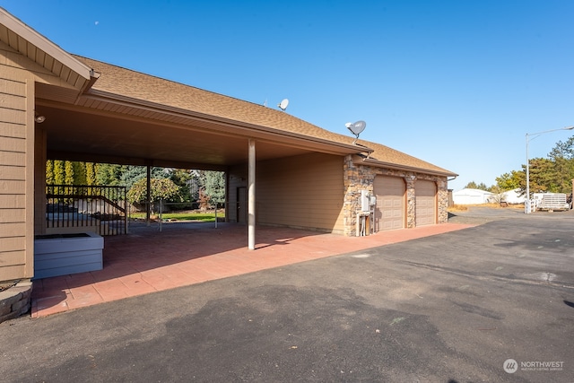 exterior space featuring a garage and a carport