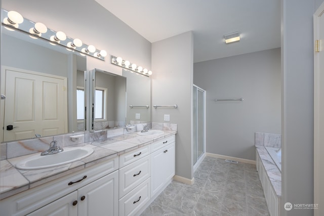 bathroom featuring vanity and separate shower and tub