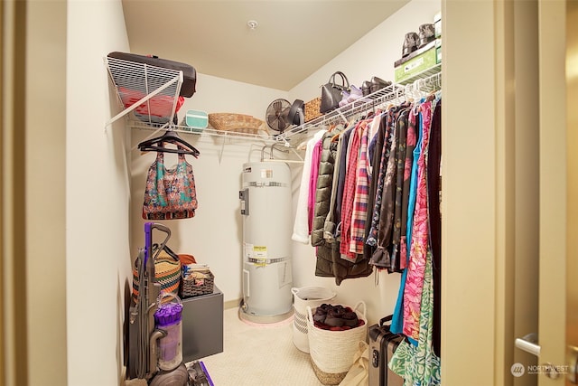 spacious closet featuring secured water heater