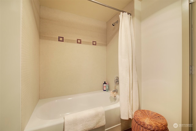 bathroom with shower / bath combination with curtain