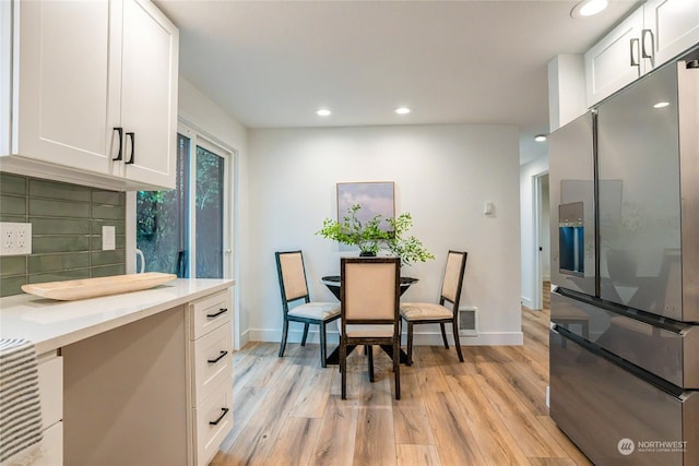 dining room with light wood-type flooring