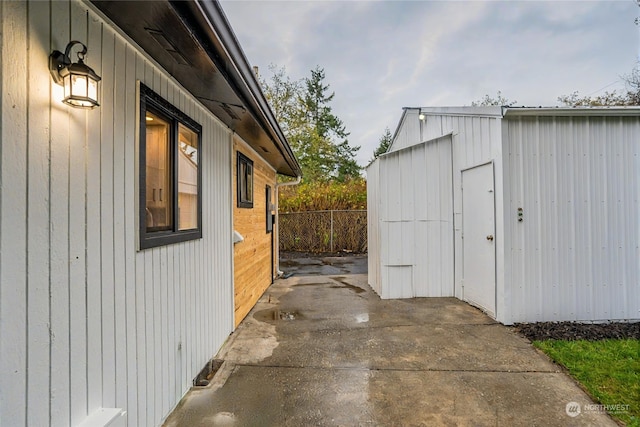 view of side of home with a patio area