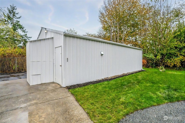 view of outdoor structure featuring a yard