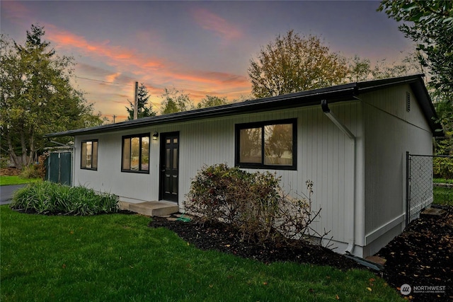 view of front of home with a lawn