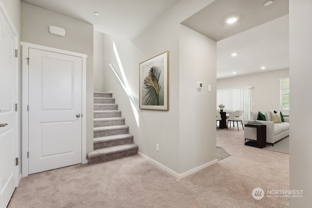 interior space featuring recessed lighting, baseboards, and carpet