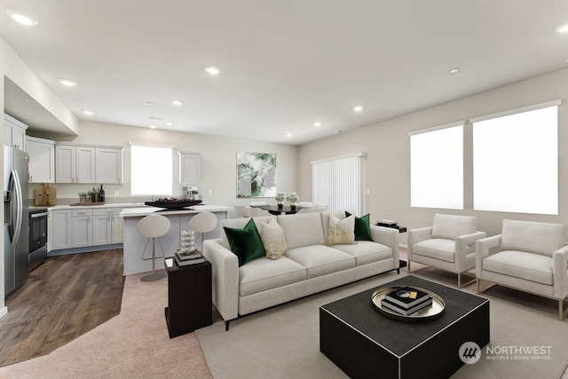 living area featuring recessed lighting and dark wood-type flooring