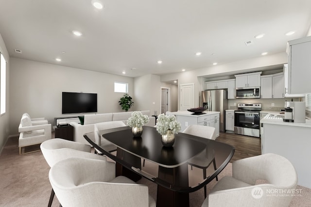 dining area with visible vents, recessed lighting, and dark wood-style flooring