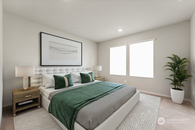 bedroom featuring baseboards and light carpet