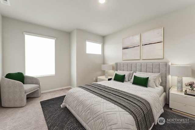 carpeted bedroom with visible vents and baseboards