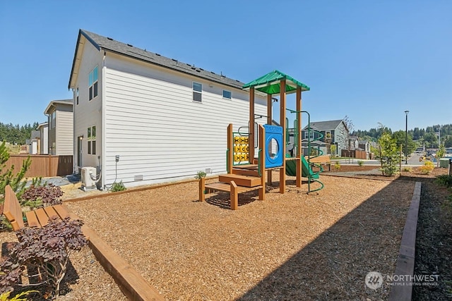 view of playground featuring fence