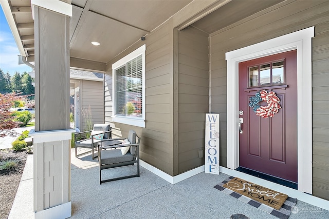 doorway to property featuring covered porch