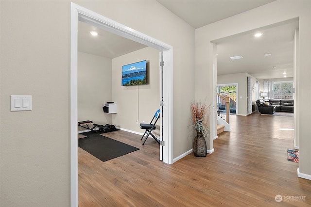 workout area featuring hardwood / wood-style flooring