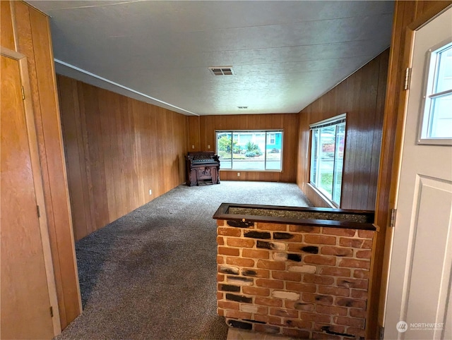930 Trosper Rd SW Unit 70, Tumwater, WA 98512 - unfurnished living room with carpet floors and wooden walls