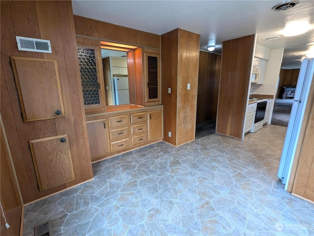 930 Trosper Rd SW Unit 70, Tumwater, WA 98512 - kitchen with white appliances and stone floors
