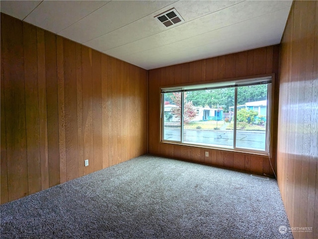 930 Trosper Rd SW Unit 70, Tumwater, WA 98512 - spare room with carpet floors and wood walls