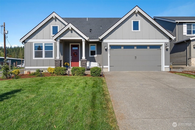 view of front of house with a garage and a front lawn