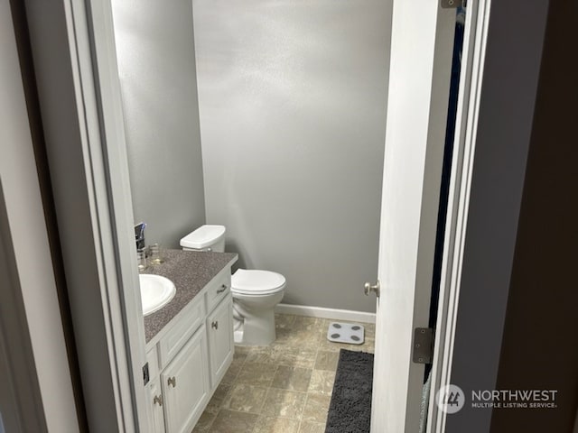 bathroom with vanity and toilet