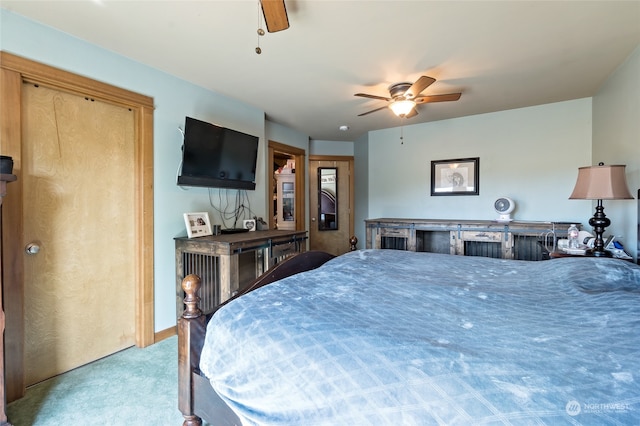 bedroom with ceiling fan and carpet