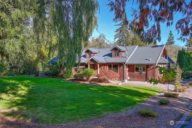 view of front of home featuring board and batten siding and a front yard