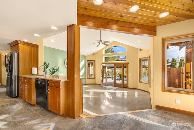 kitchen with sink, dishwasher, a healthy amount of sunlight, and stainless steel refrigerator