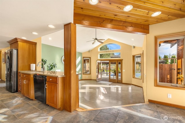 kitchen with freestanding refrigerator, dishwasher, brown cabinets, and a sink