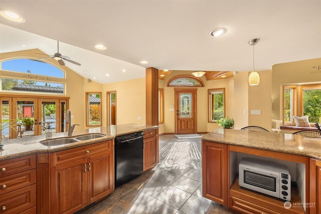 kitchen with lofted ceiling, brown cabinets, a sink, and dishwasher