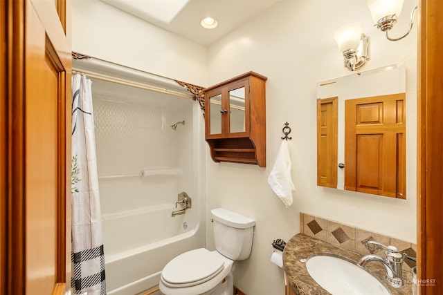 full bathroom with toilet, shower / tub combo with curtain, and vanity