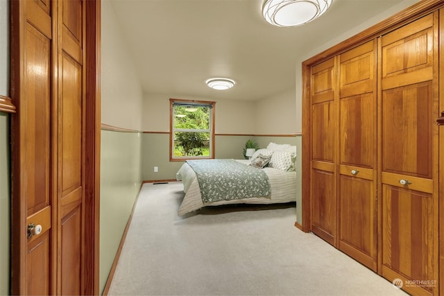 bedroom with baseboards and carpet flooring