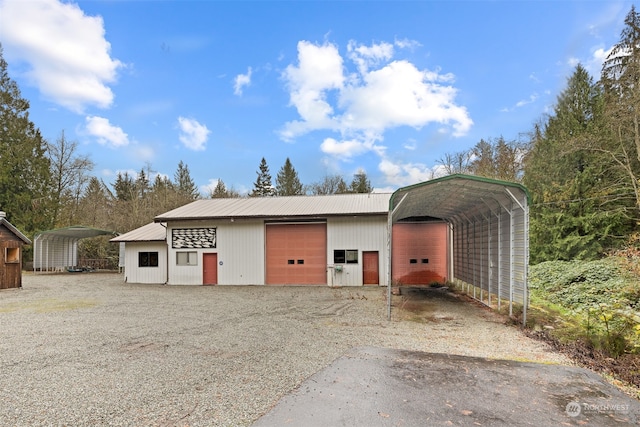 garage featuring a carport