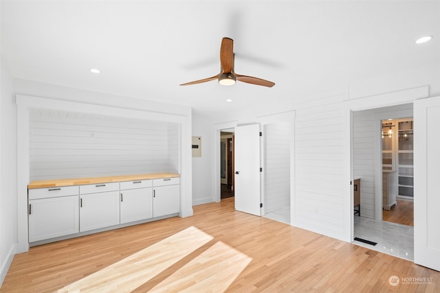 interior space featuring light hardwood / wood-style flooring and ceiling fan