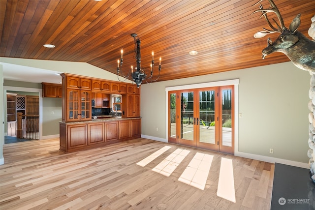 kitchen featuring light hardwood / wood-style floors, decorative light fixtures, wooden ceiling, and vaulted ceiling