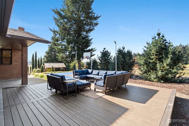 wooden deck featuring outdoor lounge area