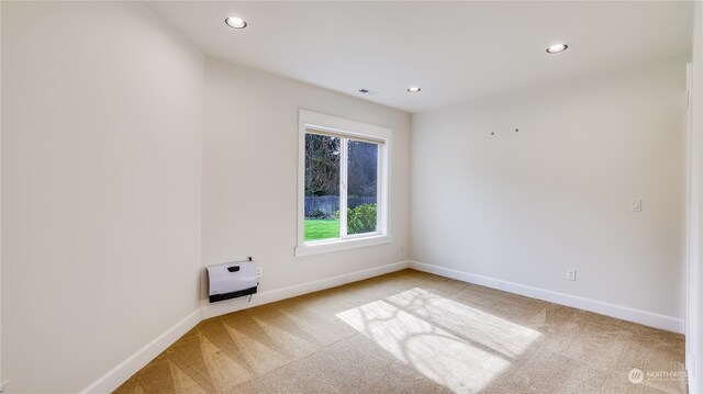 empty room featuring light colored carpet