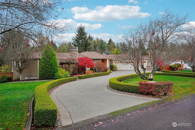 view of front facade featuring a front yard and a garage