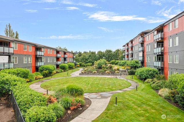 view of property's community featuring a yard