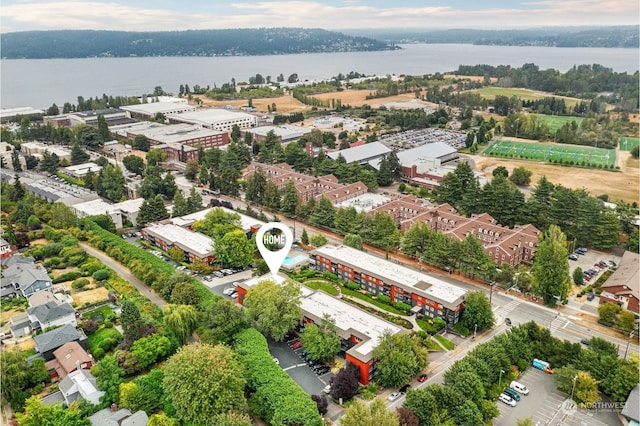 birds eye view of property with a water view