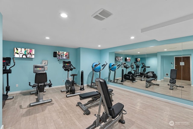 exercise room featuring hardwood / wood-style floors